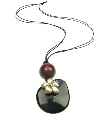 Black pebble and purple bead pendant with flower