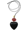 Black heart pendant with cracked raspberry bead.