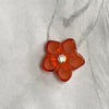 Orange diamante flower clip ear