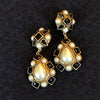 Vintage French pearl and black clip earring